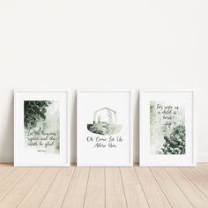 three framed art prints on a wooden floor