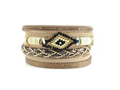 ☮ Get a layered look with one easy to put on bracelet. Bracelet consists of 6 different and beautiful leather layers and features a hand woven Miyuki beaded evil eye. Bracelet fastens with a strong and easy to close gold alloy magnetic clasp. ☮ Bracelets measures 7 1/4 inches long and about 1 1/2 inches wide. Bracelet fits a wrist up to 7 inches around. ☮ Bracelets are ready to ship ☮ Link to red bracelet: https://www.etsy.com/listing/812026710/leather-wrap-bracelet-leather-cuff?ref=shop_home_ac Adjustable Beige Bangle Bracelet, Adjustable Brown Wrap Bracelet For Party, Adjustable Brown Bracelets For Party, Gold Leather Bracelet, Layered Bracelet, Red Bracelet, Black Beaded Bracelets, Double Wrap Bracelet, Leather Cuff Bracelet