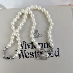 "Brand New Vivienne Westwood Silver Orb Pearl Choker Necklace Button Necklace (Brand New) Brand New, Never Worn, Nwot 100% Authentic Comes With Gift Box, Gift Bag, And Dust Bag,Brand Cards,Instruction Manual,Jewelt Cloth. Full Packing As Inculded. Necklace Packed In Secure Packaging For Transit The Length Was : 16.5'' Welcome To Sha Viviene Westwood Jewelry, Vienne Westwood Jewelry, Vivian Westwood Neckles, Vivian Westwood Necklace, Vivienne Westwood Necklace Silver, Vivienne Westwood Necklaces, Silver Vivienne Westwood, Necklace Vivienne Westwood