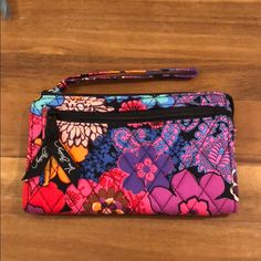 Nwot Vera Bradley Floral Wristlet Multicolor Purple Pink Blue Orange Black Etc Measures Approximately 7.5inches By 4.5inches Purple Clutch Wristlet For Everyday Use, Purple Everyday Pouch Wristlet, Purple Pouch Wristlet For Everyday Use, Purple Rectangular Wristlet For Travel, Multicolor Rectangular Wristlet With Zipper, Multicolor Rectangular Wristlet With Zipper Closure, Rectangular Multicolor Wristlet With Zipper Closure, Tweed Purse, Brown Clutch