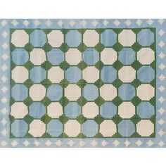 a blue and green rug with white circles on it's edges, in the shape of squares