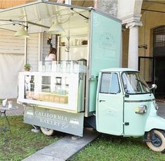 an ice cream truck parked in front of a building