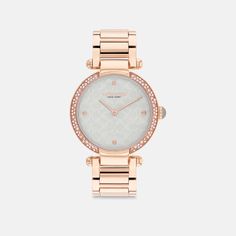 Timeless and elegant the Cary watch is a sophisticated style perfect for day or night. The sleek carnation gold tone bracelet design features a luminous mother-of-pearl Signature dial detailed with a shimmering crystal bezel. It’s finished with a crown cabochon. | Coach Cary Watch, 34 Mm - Women's - Rose Gold/light Blue Rose Gold Lights, Coach Watch, Bracelet Design, Gold Light, Minerals Crystals, Sophisticated Style, Bracelet Designs, Quartz Movement, Accessories Watches