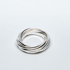 This ring is not only comfortable and stylish, it is playful too, as it rolls on to your finger.  It is 7 single bands that are interlinked to form one ring.  It is not a puzzle ring, so if you drop it, you don't need to worry about putting it back together.

We have a bangle that matches it, and even a pendant.

The bangle is BGG116 FOR $180
The pendant is PGG301  for $90 Bands Rings, Puzzle Ring, Silver Bands, Back Together, Silver Band Ring, One Ring, Sterling Silver Bands, Band Rings, Sterling Silver Jewelry