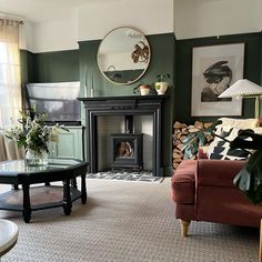 a living room filled with furniture and a fire place