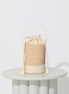 Handmade in Morocco, the Cleobella Kira Bucket Bag is a must-have for any handbag collection. Ethically Handmade in Morocco Raffia with leather detailing Hand Tooled whipstitch Details Drawstring closure lined Interior Flat bottom Leather Detailing, Handbag Collection, Vanessa Mooney, White Hot, Cold Weather Accessories, Knit Sweatshirt, Hot Dress, Hat Hairstyles, Shoe Shop