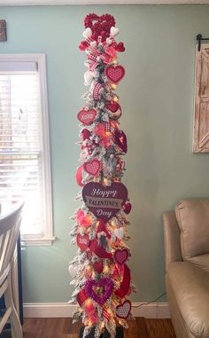 a decorated christmas tree in the corner of a room