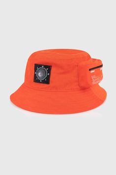 Official presents the Bio-Tracker Cargo Bucket Hat Features: Orange distressed nylon Drawstring with cinch adjuster Zippable cargo pouch on left side Woven patch front logo and screen printed graphic on cargo pouch Moisture Wicking Comfort Designed Cotton Sweatband Cheap Orange Baseball Cap With Flat Bill, Cheap Flat Bill Hats For Gifts, Cheap Orange Snapback Hat For Streetwear, Cheap Orange Trucker Hat For Outdoor, Bucket Hat Ideas, Custom Bucket Hats, Kangol Hats, Headwear Fashion, Bucket Hat Summer