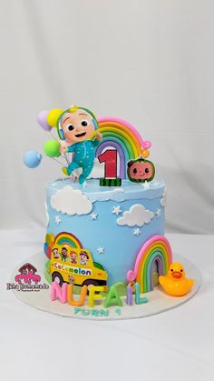 a birthday cake decorated with characters and balloons