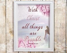 a white frame with pink flowers and the words, with christ all things are possible