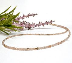 This dainty gemstone beaded necklace features tiny 2mm faceted round peach moonstone beads with metal accent beads randomly scattered throughout. Perfect for layering or wearing by itself as a simple, minimalist boho choker! 💜 𝗖𝗥𝗘𝗔𝗧𝗘 𝗔 𝗦𝗘𝗧 𝗗𝗜𝗦𝗖𝗢𝗨𝗡𝗧 💜 * Order both a necklace and a bracelet (or anklet) and use the code MARLEYMATCHYMATCHY at checkout to receive 25% off your matching set! * Different lengths are available for most pieces described as a bracelet or necklace, allow Understated Jewelry, Beads Choker, Neutral Boho, Tiny Beads, Boho Choker, Silver Jewelry Design, Gemstone Beaded Necklace, Natural Gemstone Jewelry, Moonstone Beads