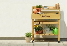 a potting bench with gardening tools on it