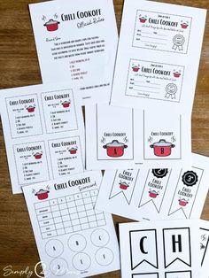 four printable chili cookbook pages on top of a wooden table with other items