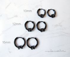 * Surgical Stainless Steel Huggie Hoop earrings with small rings. Round Huggie Hoop. Men's Hoop Earrings. Black. * This listing is for 1 piece -or 2 pieces (choose from drop down menu) * These earrings are made of 316L surgical steel. IP Plated. Nickel Free. * Dimensions : Diameter: Choose from -Inner 10 mm / Outer 13 mm -or- -Inner 12 mm / Outer 16 mm -or- -Inner 15 mm / Outer 18 mm Thickness: 2.5 mm Post Gauge: 18G (1mm) standard piercing **Measurements are an approximation. Size, shape and co Black Hypoallergenic Hoop Earrings In Stainless Steel, Black Hypoallergenic Hoop Cartilage Earrings, Black Hoop Cartilage Earrings For Gift, Hypoallergenic Surgical Steel Hoop Earrings, Rings Mens, Mens Earrings Hoop, Cartilage Hoop, Surgical Steel Earrings, Titanium Earrings