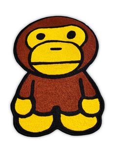 a yellow and brown monkey rug on a white background