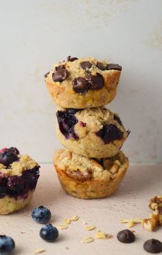 three blueberry muffins stacked on top of each other