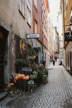 a cobblestone street in an old european city