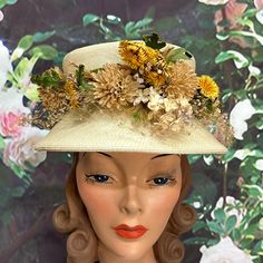 Vintage 1960's Gimbels beige straw hat has a band of green velvet. It has pretty, dried wildflowers in yellow and tan with green leaves. There is a fine net around the brim. Very good condition with a few small spots and faint staining on the top of the crown. Please see photos for more details. All items are vintage that are preowned. All of the items may show some form of wear due to their age. Please kindly remember that these items are anywhere from 30-80 years old. I make every attempt to c Dried Wildflowers, Cave Creek Az, Battenburg Lace, Cave Creek, Evening Purse, Feb 13, Bucket Hats, 80 Years, Green Velvet