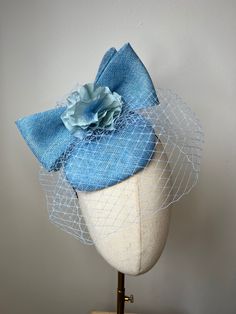 This beautiful blue Sinamay fascinator features birdcage veil, matching pink bow with hydrangea petals and sits on a blue metal aliceband.  This Fascinator is stunning, perfect for all summer events, weddings and races. Brand New. If you need your item by a certain date please let me know. Made in the UK. All items are handmade and may differ very slightly to picture shown.  Custom orders are welcome. Many more items are available in our Shop. Returns Please notify us within 3 days of receiving Blue Adjustable Fascinator For Garden Party, Blue Headband For Spring Wedding, Light Blue Headpieces For Spring Wedding, Spring Wedding Mini Hat With Bow, Blue Adjustable Fascinator For Gift, Spring Wedding Fascinator With Bow, Blue Whimsical Wedding Headpiece, Birdcage Veil Wedding, Hydrangea Petals