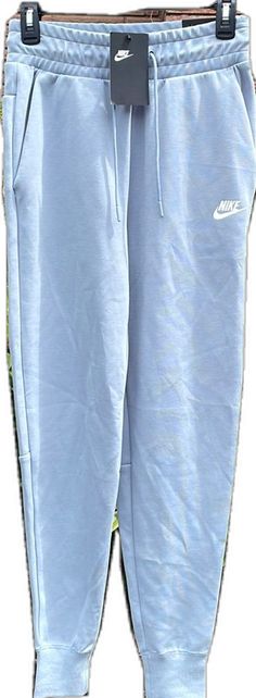 Nike Blue Relaxed Fit Sweatpants, Nike Cotton Pants For Spring, Nike Cotton Bottoms, Nike Cotton Bottoms In Solid Color, Blue Summer Sweatpants For Loungewear, Sporty Light Blue Cotton Pants, Light Blue Sporty Cotton Pants, Light Blue Cotton Sporty Pants, Blue Relaxed Fit Sweatpants For Spring