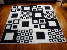 a black and white area rug on the floor