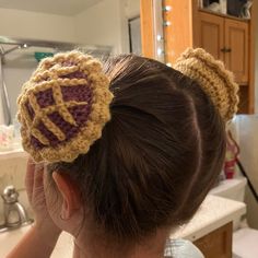 "My daughter is obsessed with pie and I've been messing around with crochet for the past year so this creation was inevitable. The pie is built off of an elastic hair tie at its base, which allows for you to stretch it open to fit over a sturdy bun of hair (refer to video).  There are 2 colors/flavors so far, Orange/Pumpkin and Maroon/Raspberry. Made with medium 7oz 100% Acrylic Yarn and clasp free thick elastic hair tie.  Each pie measures: 3.5\" x 3.5\" x 2\" outside measurement (not stretched sample had 1.5\" inside depth pictured) Delicate Care Directions state: Hand wash, lay flat to dry. Care directions of yarn says : Machine wash warm, gentle cycle. Tumble dry low. Do not over dry (though I will assume that's for if you make it into a blanket or something else hefty, not intricate p Crochet Hair Bun Cover Free Pattern, Small Wearable Crochet Projects, Crochet Bun Cover Pattern Free, Quick Crochet Accessories, Crochet Bun Cover, Cute Crochet Scrunchies, Small Things To Crochet Ideas, Crochet Cable Tie, Knit Hair Accessories