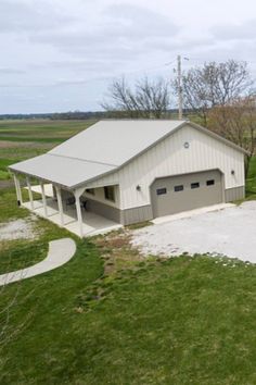 an aerial view of a house with two garages