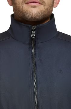 Every closet craves this edgy bomber styled with handy side pockets, a water-resistant finish and comfy ribbed trim. Front zip closure Stand collar Front zip pockets Ribbed cuffs and hem Water resistant Lined 100% polyester Machine wash, line dry Imported Athleisure Half-zip Outerwear With Zipper Closure, Athleisure Outerwear With Half-zip Closure, Fitted Windbreaker With Zipper Closure For Fall, Fitted Windbreaker With Zipper For Fall, Nylon Track Jacket With Zipper Closure For Fall, Functional Half-zip Track Jacket For Fall, Fall Nylon Track Jacket With Zipper Closure, Fitted Calvin Klein Athleisure Tops, Fall Half-zip Track Jacket With Zipper Closure