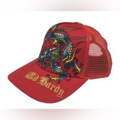 Ed Hardy Dragon Snapback Trucker Hat Color: Red Style# Ehh0001-38 Printed And Embroidered Logos One Size Fits Most Adults Front Panel: 100% Cotton Back Panel 100% Polyester Sunshade Back 76% Cotton, 17% Rayon, 7% Polyester Made In China Red Trucker Hat With Visor, Red Cap Hat, One Size Fits Most, Adjustable Red Trucker Hat, Red Snapback Hat, One Size Fits Most, Red Short Brim Baseball Cap For Spring, Red Adjustable Snapback Hat, Red Snapback Hat With Short Brim For Summer, Red Snapback Visor Hat For Summer, Red Baseball Cap Snapback Hat For Spring