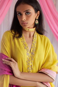 Marigold yellow kaftan in chiffon base with floral motif hand embroidered neckline.
Component: 1
Pattern: Embroidered
Type Of Work: Floral Motifs
Neckline: V-Neck
Sleeve Type: Three Quarter
Fabric: Chiffon, Lining: Shantoon
Color: Yellow
Other Details: 
Side drops
Note: The dupatta worn by the model is not for sale
Occasion: Party - Aza Fashions Gold Georgette Kurta For Diwali, Gold Georgette Palazzo Set For Eid, Traditional Gold Georgette Kurta, Gold Georgette Kurta For Festivals, Elegant Yellow Anarkali Set For Designer Wear, Elegant Designer Yellow Anarkali Set, Traditional Yellow Georgette Dress, Traditional Georgette Kaftan With Dupatta, Gold Georgette Kurta With Traditional Drape