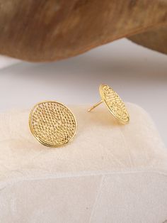 Inspired by the 5,000-year-old technique of granulation, these asymmetrical round earrings showcase a textural surface encased in a delicate border of finely twisted gold wire. Meet your new everyday stud earrings. • Available in 14 karat recycled yellow gold• 18 mm round• Post back, butterfly clasp Learn more about our sustainability practices here. Hand-crafted in our Brooklyn, NY studio. All pieces (except in stock items) are made to order, please allow 1-3 weeks for delivery. All in stock it Everyday Stud Earrings, Everyday Earrings Studs, Gold Wire, Round Earrings, 3 Weeks, Sustainability, Brooklyn, Hand Crafted, Yellow Gold