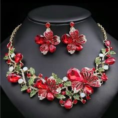 Brand New. Red. Striking Necklace And Earring Set From Jane Chic Designs. Beautiful Flower Design With Inlaid Rhinestones. This Is A Must Have Statement Piece. This Is Perfect For Weddings, Parties, Or Any Other Special Occasion. Great Gift For Birthdays, Mother’s Day, Or Any Other Special Celebration. Made Of High Quality Alloy And Crystal. It Is Easy And Comfortable To Wear. Red Crystal Jewelry Sets For Valentine's Day, Red Crystal Jewelry For Valentine's Day, Red Crystal Jewelry With Matching Earrings, Elegant Red Flower-shaped Jewelry, Red Jewelry Set With Jewels For Gift, Red Jewelry Sets For Gifts, Red Costume Jewelry For Valentine's Day, Red Jeweled Jewelry For Valentine's Day, Red Jewels Jewelry For Valentine's Day