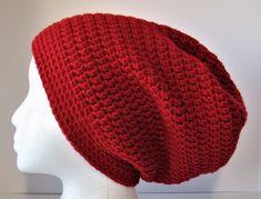 "This bright red crochet slouchy hat would be perfect as your \"go-to\" slouchy beanie for the cold weather season.  It is crocheted in 100% acrylic yarn.  Its close stitching construction will keep your head toasty even on the coldest days.  A flat border hugging the face and ears adds to its warmth.  This hat is appropriate for women, men, and teens. The hat is sized for a larger head.  It is stretchy for a comfortable fit.  (See measurements below for specific details.) This hat would be perf Cheap Red Brimmed Crochet Hat, Cheap Red Crochet Hat, Crochet Slouchy Hat, Slouchy Beanie Hat, Red Crochet, Weather Seasons, Slouchy Hat, Slouchy Beanie, Crochet Hat