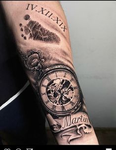 a man with a tattoo on his arm has a clock and words written in it