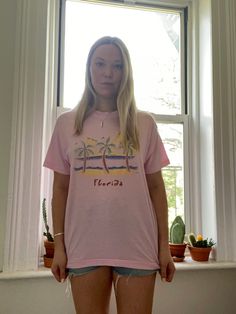 "Vintage pink Florida tee from the 1980s - 1990s  Made in U.S.A.  Fabric: 50% cotton 50% polyester  Tag: Screen Stars, adult size XL  Best fits a modern US size M - XL  Measurements: laying flat  Length: 29\"  Width: 21.5\"  Sleeve: 7\"  Condition: Very good vintage condition. Light pilling but no stains or holes" 90s Inspired Short Sleeve T-shirt With Screen Print, 90s Inspired Pre-shrunk Summer T-shirt, Retro Pink T-shirt For Streetwear, Vintage Pre-shrunk T-shirt For Spring, 90s Inspired Screen Print Summer T-shirt, Pink Retro Graphic Print T-shirt, 90s Style Pink T-shirt With Graphic Print, Vintage Pink Crew Neck Tops, 90s Inspired Pink T-shirt For Spring