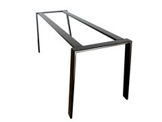 a metal table that is standing up against a white background