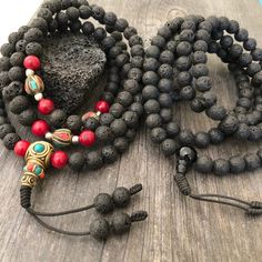 Everyday black lava stone mala necklace. You can choose between 2 styles. 1- A Mala necklace that is all black lava stones which is 43cm- 17 inch long (there is no clasp, you wear it over the head) 2-A Mala necklace which has black lava stones, red beads and unique Nepali beads. This Mala is 48cm- 19 inch long ( there is no clasp, you wear it over your head) This unique unisex mala necklaces can be a diffuser necklaces also, as you can choose which ever oil that you like to use with the lava roc Bohemian Black Lava Stone Jewelry, Black Lava Stone Jewelry With Round Beads, Black Lava Stone Bohemian Jewelry, Black 8mm Beads Jewelry For Meditation, Spiritual Black Beaded Necklaces, Black Beaded Lava Stone Jewelry, Black Beads Lava Stone Jewelry, Black Lava Stone Necklace For Gift, Black Lava Stone Round Bead Necklaces