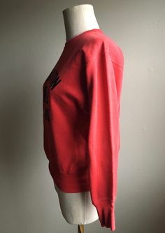 "1960s vintage pullover sweatshirt Brand- Athletic Supply made in USA cotton red with black lettering faded stitching Washington Junior High 3 wide ribbed sleeve cuff/waist hem band ribbed underarm panels authentic distressed quality small stain right sleeve cuff repairs to back ribbed hem/left sleeve above cuff label size small measures, lying flat, shoulder-17\" sleeve-20 1/2\" chest-19\" hem-14 1/2\" length-23\"" Red Cotton Sweats With Ribbed Cuffs, Vintage Red Crew Neck Sweater, Red Vintage Crew Sweater, Red Varsity Top With Ribbed Cuffs, Retro Red Top With Ribbed Cuffs, Red Sweats With Ribbed Cuffs For Fall, Vintage Red Long Sleeve Sweatshirt, Red Vintage Long Sleeve Sweatshirt, Red Collegiate Sweatshirt With Ribbed Cuffs