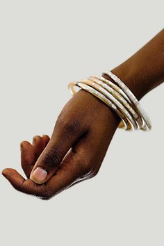 Unique and exotic, the Tribe and Glory Ankole Horn Bangles are beautifully handcrafted and can add to any outfit. Stack them up or mix and match, the bangles will definitely be the talk of the town. Please note that due to the stunning variation in the horn, the current supply of dark bangle sets is un-patterned and opaque black. Traditional Fair Trade Bracelets, Fair Trade Festival Bracelets, Bohemian White Bangle Jewelry, White Handmade Bohemian Bangle, Bohemian Fair Trade Bracelets, Adjustable White Bangle, Minimal Wallet, The Bangles, Horn Jewelry