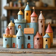 a group of colorful wooden buildings sitting on top of a table