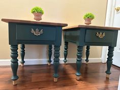 two green end tables with plants on top