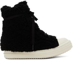 High-top shearling sneakers in black and off-white. · Round leather cap toe · Lace-up closure · Extended tongue · Zip closure at inner side · Treaded rubber sole · Silver-tone hardware Supplier color: Black/Milk | Rick Owens Black Shearling Strobe Sneakers Rick Owens Boots, Black High Top Sneakers, Money Goals, Black High Tops, Round Leather, Black Milk, Leather Cap, Wedge Sneaker, Rick Owens