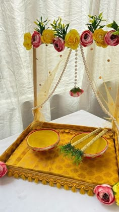 an elaborately decorated tray with flowers on it