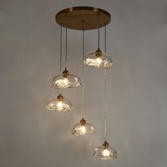 three lights hanging from the ceiling in a room