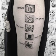 a man's upper arm with four different symbols and the words crystals out of time