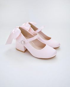 This flower girls satin block heels adorn with a charming satin bow detail on the back, charming and elegant shoes designed for little princess for birthday party, holiday party, wedding party, flower girls, quinceanera shoes, and other special occasions. The satin material adds a sophistication to the overall look, making them perfect for formal occasions. DETAILS: HEEL HEIGHT: 2 inches UPPER: Synthetic upper and lining MATERIALS: Manmade outsole ORIGIN: Imported STYLE NAME: SOPHIA Not sure of which size to purchase? Shoes measurements are as follow: (Please note measurements taken the length of inside of shoe from toe to heel) TODDLER -  Size 9:  7 inches -  Size 10: 7.25 inches -  Size 11:  7.50 inches -  Size 12: 7.75 inches LITTLE KID -  Size 13:  8 inches -  Size 1:   8.25 inches - Kid High Heels, Flower Girls Shoes, Quinceanera Shoes, Birthday Shoes, Kids Heels, Women's Slip Ons, Flower Girl Shoes, Girls Heels, Princess Shoes