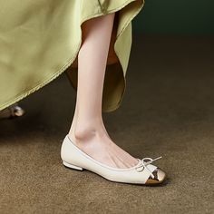 Looking for the perfect pair of ballet flats? Check out our beige ballet flats! Boasting a gold cap toe and bow. our ballet flats are perfect for everyday wear. as well as special occasions. Upper: Sheepskin Lining: Leather Outsole: TPR Toe: Cap Toe Closure: Slip on Color: Pink. Beige is_handmade: Yes Gold Pointed Toe Flats For Spring, Chic Cream Closed Toe Ballet Flats, Elegant Spring Pointed Toe Flats With Metal Feet, Spring Cap Toe Flats, Elegant Beige Round Toe Ballet Flats, Elegant Beige Flats With Bow, Elegant Beige Almond Toe Ballet Flats, Gold Pointed Toe Ballet Flats For Party, Elegant Cream Ballet Flats With Round Toe