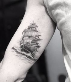 a black and white photo of a ship on the arm