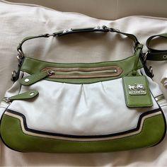 Vintage Coach Madison Purse Rare Two Tone Green & Off White Includes Long Strap Please See All Pictures For Condition This Rare Coach Madison Satchel Is A Stunning Two-Tone Piece In Green And Off-White Colors. It Comes With A Long Strap For Added Convenience. The Exterior Is Made Of High-Quality Leather Material While The Interior Is Lined With Satin In A Beautiful Green Color. The Hardware Is Silver In Color, Completing The Beautiful Design Of The Bag. The Bag Is A Perfect Addition To Any Wardrobe, Suitable For Any Occasion. Its Two Tone Design And Additional Green Handle/Strap Color Give It A Classic And Elegant Look. The Size Is Large Enough To Fit All Your Essentials While The Numerou Green Coach Bag, Last Picture Show, The Last Picture Show, Coach Logo, Bags Logo, White Colors, Off White Color, Vintage Coach, Leather Material