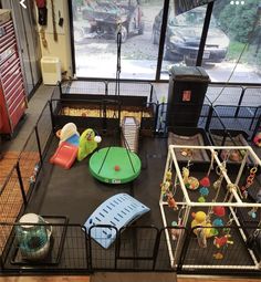 there are many toys in the caged area